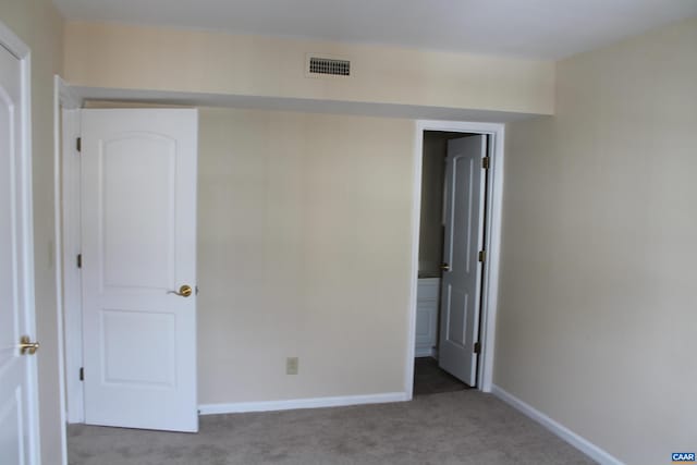 1313 Villa Way Unit F, Charlottesville, VA 22903 - unfurnished bedroom featuring ensuite bathroom, carpet floors, baseboards, and visible vents