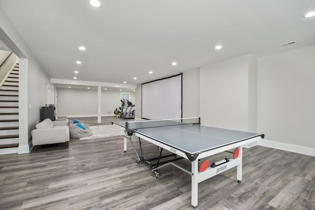 playroom featuring baseboards, wood finished floors, and recessed lighting