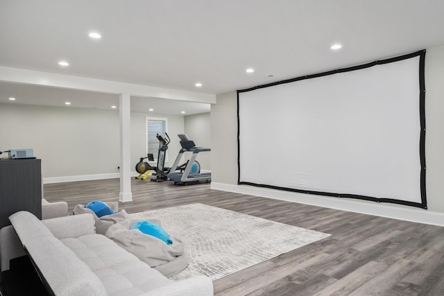 cinema room featuring recessed lighting, baseboards, and wood finished floors