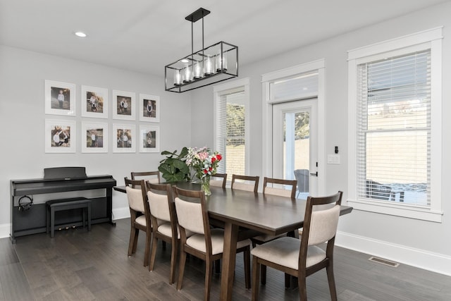 dining area with baseboards, visible vents, dark wood-type flooring, and recessed lighting