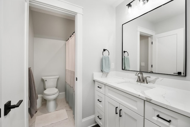 bathroom with toilet, marble finish floor, baseboards, and vanity