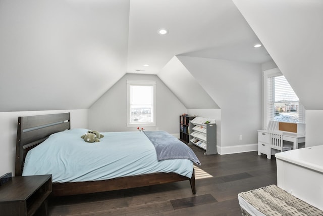 bedroom featuring lofted ceiling, dark wood-style flooring, multiple windows, and baseboards