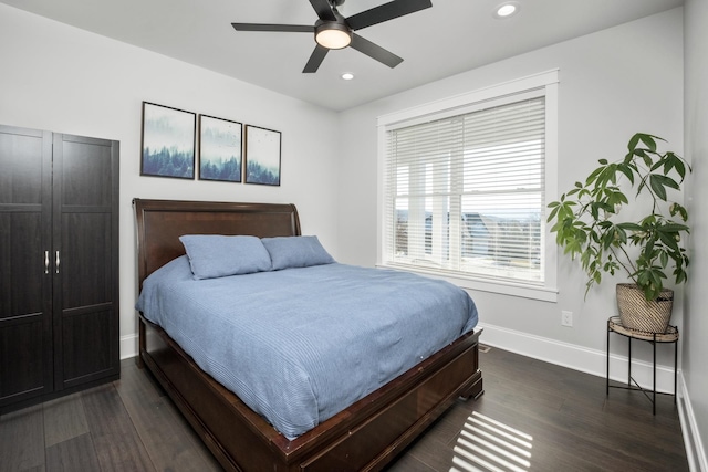 bedroom featuring recessed lighting, dark wood finished floors, a ceiling fan, and baseboards