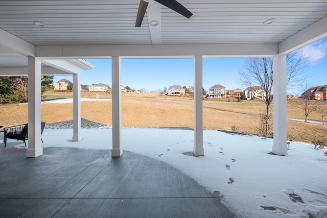 view of patio / terrace with ceiling fan and a residential view