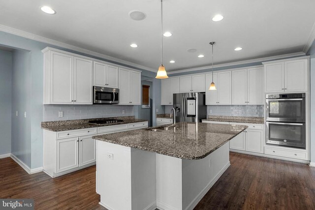 1708 Hudgins Farm Cir, Fredericksburg, VA 22408 - kitchen with stainless steel appliances, crown molding, an island with sink, white cabinets, and tasteful backsplash