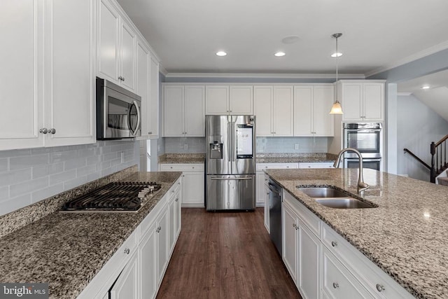 1708 Hudgins Farm Cir, Fredericksburg, VA 22408 - kitchen with appliances with stainless steel finishes, white cabinets, dark wood-type flooring, pendant lighting, and tasteful backsplash
