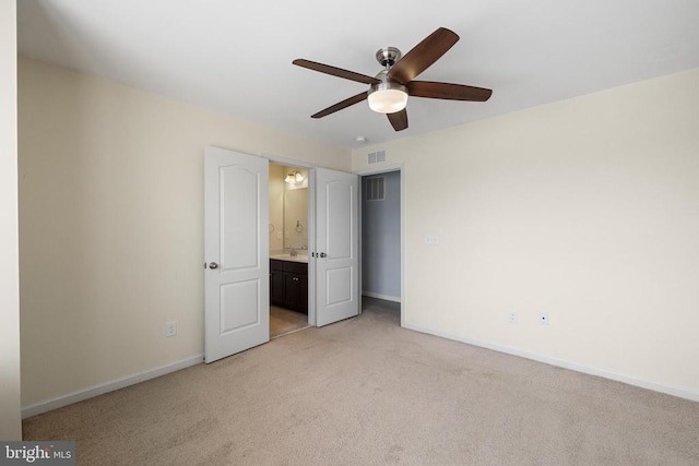 1708 Hudgins Farm Cir, Fredericksburg, VA 22408 - unfurnished bedroom with light colored carpet, connected bathroom, and a ceiling fan