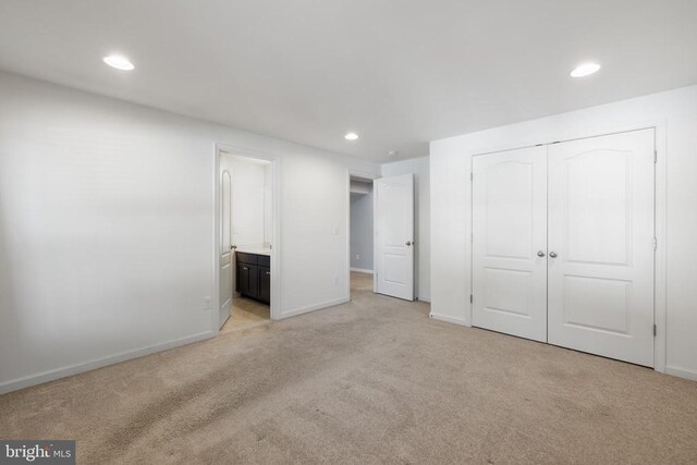 1708 Hudgins Farm Cir, Fredericksburg, VA 22408 - unfurnished bedroom featuring light colored carpet, recessed lighting, a closet, and ensuite bathroom