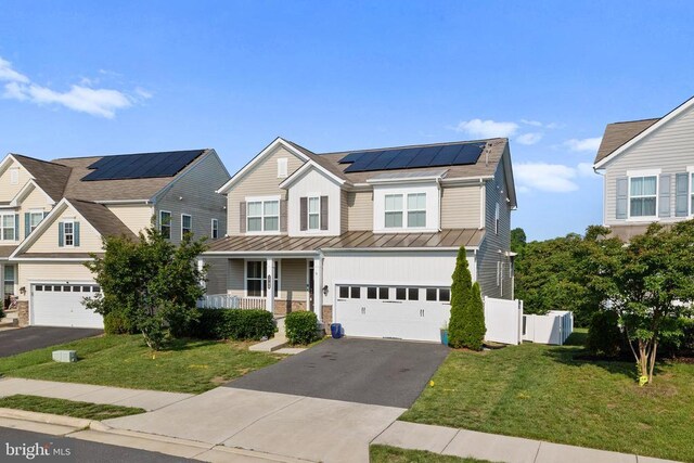 1708 Hudgins Farm Cir, Fredericksburg, VA 22408 - view of front of property featuring a standing seam roof, asphalt driveway, solar panels, covered porch, and a metal roof