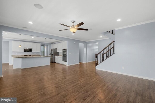 1708 Hudgins Farm Cir, Fredericksburg, VA 22408 - unfurnished living room with ornamental molding, a ceiling fan, recessed lighting, stairs, and dark wood-style flooring