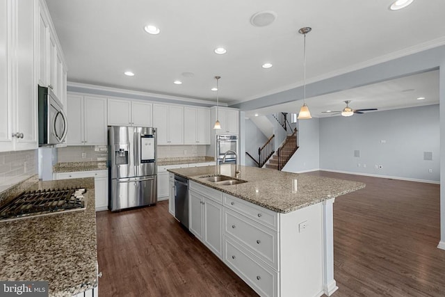 1708 Hudgins Farm Cir, Fredericksburg, VA 22408 - kitchen with stainless steel appliances, white cabinets, ceiling fan, decorative backsplash, and ornamental molding