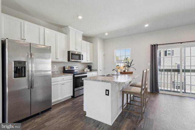 36097 Fawn Ln, Locust Grove, VA 22508 - kitchen with a sink, dark wood finished floors, a kitchen island with sink, and appliances with stainless steel finishes