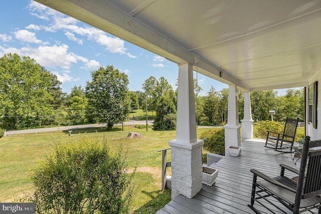 7934 Courthouse Rd, Spotsylvania, VA 22551 - wooden porch featuring a lawn and view of scattered trees