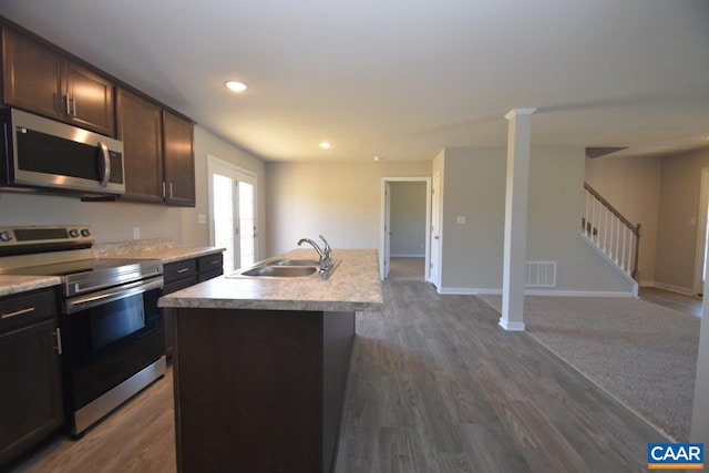 1211 Shenandoah Crossing Dr, Gordonsville, VA 22942 - kitchen with a sink, stainless steel appliances, open floor plan, dark wood finished floors, and light countertops
