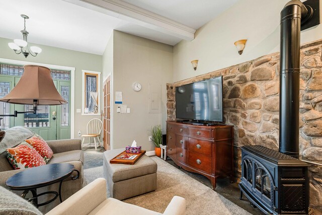 409 Lower Rawley Ln, Hinton, VA 22831 - carpeted living area with a wood stove and a chandelier