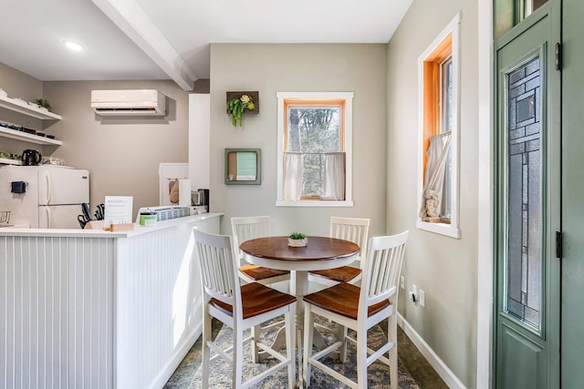409 Lower Rawley Ln, Hinton, VA 22831 - dining space featuring beam ceiling, baseboards, and a wall unit AC