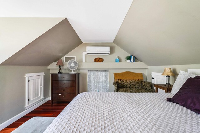 409 Lower Rawley Ln, Hinton, VA 22831 - bedroom featuring vaulted ceiling, wood finished floors, baseboards, and an AC wall unit
