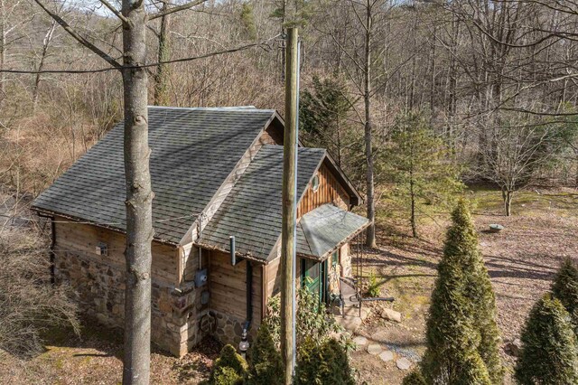 409 Lower Rawley Ln, Hinton, VA 22831 - view of side of property with stone siding, a view of trees, and a shingled roof