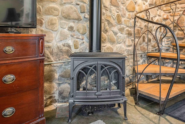 409 Lower Rawley Ln, Hinton, VA 22831 - room details featuring a wood stove and unfinished concrete flooring