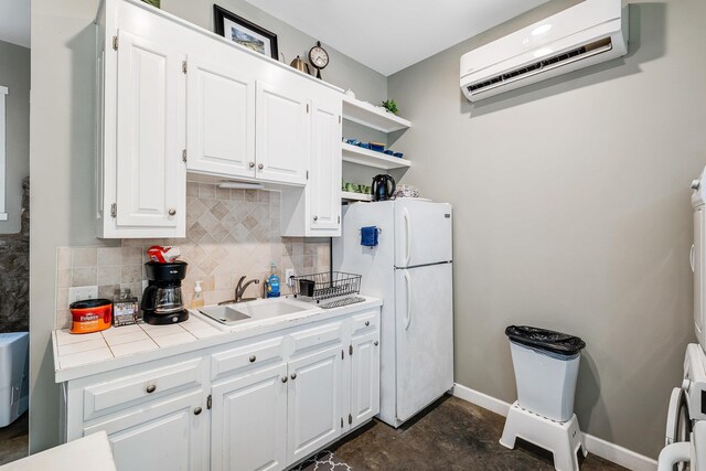 409 Lower Rawley Ln, Hinton, VA 22831 - kitchen with a sink, freestanding refrigerator, open shelves, white cabinets, and a wall mounted AC