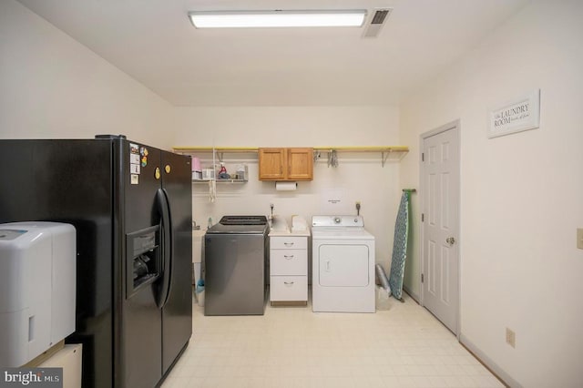 108 Harris Ct, Locust Grove, VA 22508 - laundry room featuring washing machine and dryer, light floors, and cabinet space