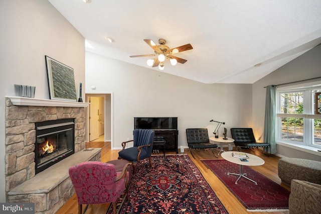 108 Harris Ct, Locust Grove, VA 22508 - living room with vaulted ceiling, wood finished floors, a fireplace, ceiling fan, and baseboards