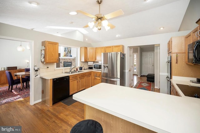 108 Harris Ct, Locust Grove, VA 22508 - kitchen featuring black appliances, lofted ceiling, wood finished floors, ceiling fan, and light countertops
