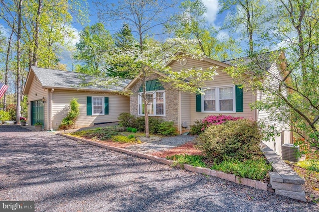 108 Harris Ct, Locust Grove, VA 22508 - view of front of house featuring central AC unit and a garage