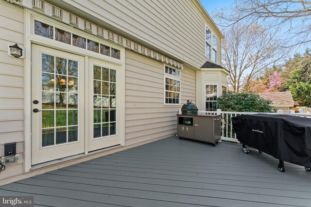 wooden terrace with area for grilling