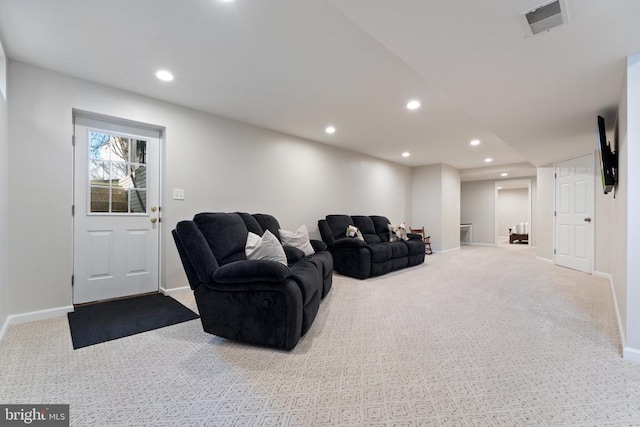 carpeted living room with recessed lighting and baseboards