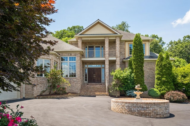 3417 Lake Pointe Dr, Rockingham, VA 22801 - property entrance with a balcony and brick siding