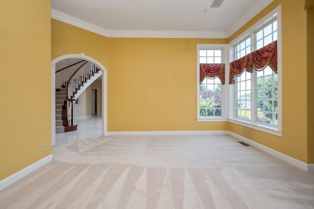 3417 Lake Pointe Dr, Rockingham, VA 22801 - empty room featuring carpet flooring, crown molding, and arched walkways
