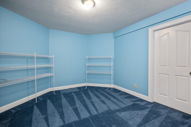 3417 Lake Pointe Dr, Rockingham, VA 22801 - unfurnished bedroom featuring dark carpet and a textured ceiling