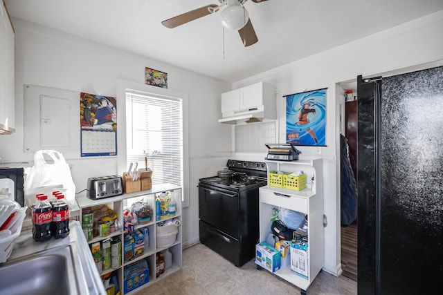 608 Hawkins St, Harrisonburg, VA 22801 - kitchen with a ceiling fan, black range with electric cooktop, white cabinets, under cabinet range hood, and light countertops