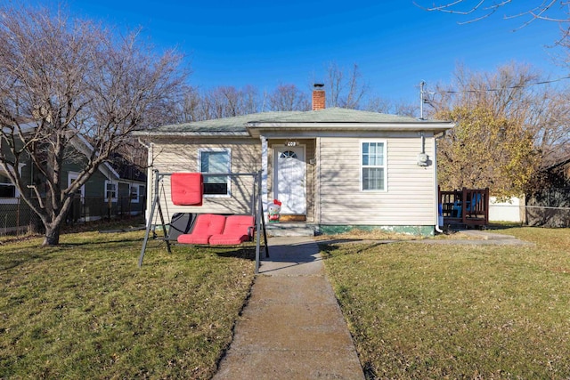 608 Hawkins St, Harrisonburg, VA 22801 - bungalow with a chimney, a front yard, and fence