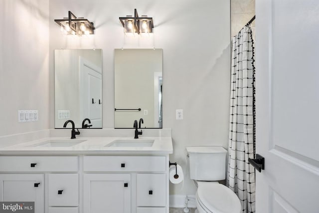 11207 Redlands Trl, Spotsylvania, VA 22551 - bathroom featuring toilet, double vanity, and curtained shower