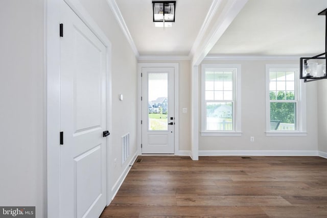 11207 Redlands Trl, Spotsylvania, VA 22551 - entryway featuring dark wood-style floors, crown molding, and baseboards