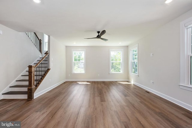11207 Redlands Trl, Spotsylvania, VA 22551 - unfurnished living room with wood finished floors, ceiling fan, stairway, baseboards, and recessed lighting