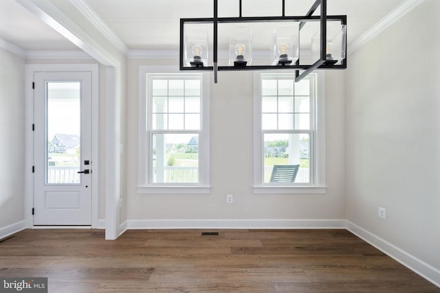 11207 Redlands Trl, Spotsylvania, VA 22551 - unfurnished dining area featuring crown molding, healthy amount of natural light, and wood finished floors