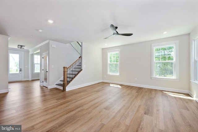 11207 Redlands Trl, Spotsylvania, VA 22551 - unfurnished living room with stairway, light wood-style flooring, ceiling fan, baseboards, and recessed lighting