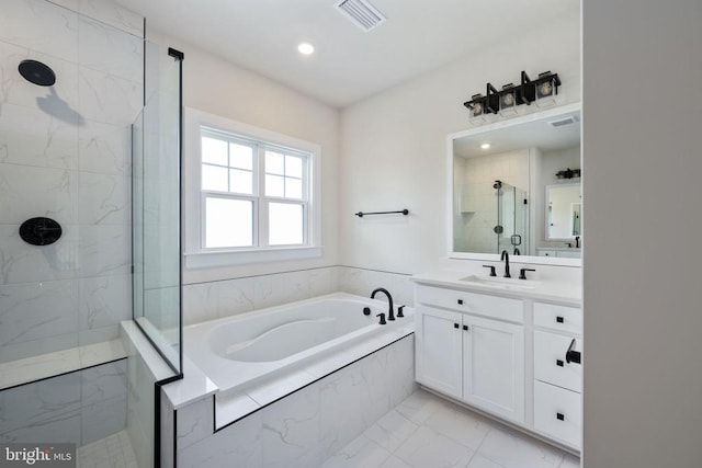 11207 Redlands Trl, Spotsylvania, VA 22551 - bathroom with marble finish flooring, a stall shower, a garden tub, vanity, and recessed lighting