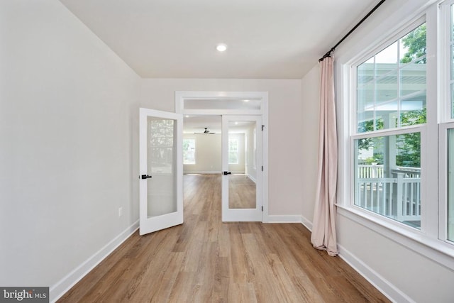 11207 Redlands Trl, Spotsylvania, VA 22551 - empty room featuring light wood-style flooring, plenty of natural light, and baseboards