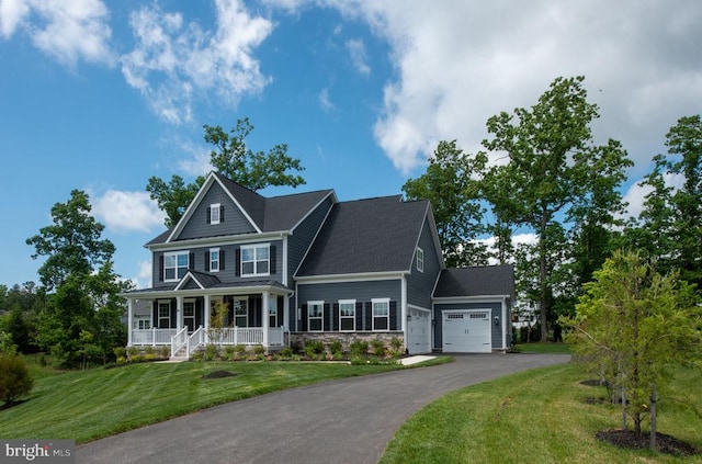 11207 Redlands Trl, Spotsylvania, VA 22551 - view of front of home featuring a porch, a garage, driveway, a front lawn, and stone siding