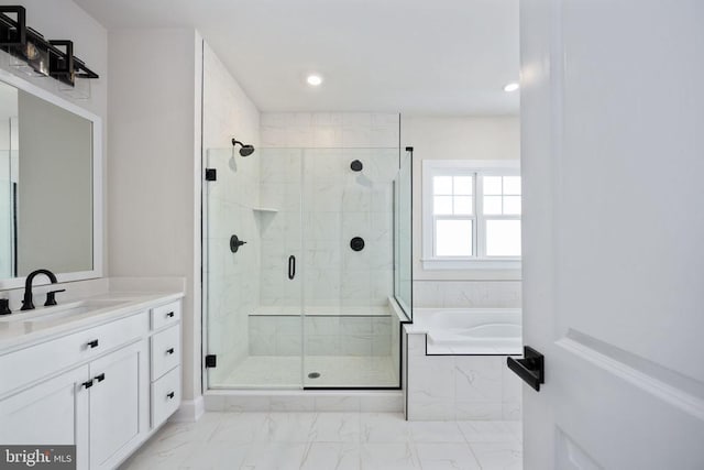 11207 Redlands Trl, Spotsylvania, VA 22551 - bathroom with marble look tiles, a shower stall, a bath, recessed lighting, and vanity