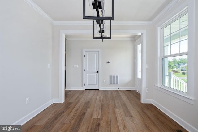11207 Redlands Trl, Spotsylvania, VA 22551 - unfurnished dining area with wood finished floors, crown molding, and baseboards