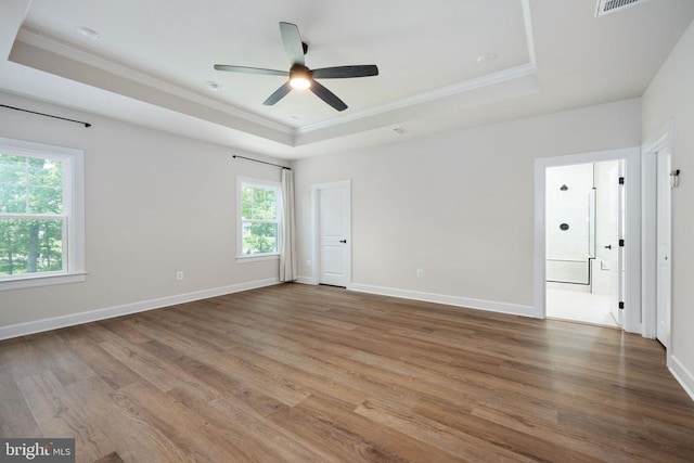 11207 Redlands Trl, Spotsylvania, VA 22551 - spare room featuring a tray ceiling, ornamental molding, wood finished floors, ceiling fan, and baseboards