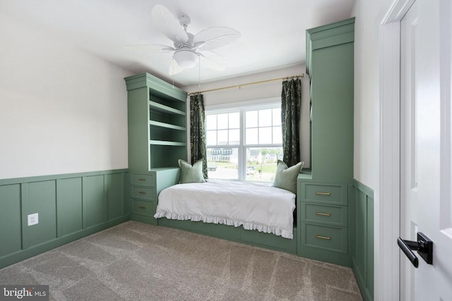 11207 Redlands Trl, Spotsylvania, VA 22551 - bedroom featuring carpet floors, wainscoting, a decorative wall, and ceiling fan