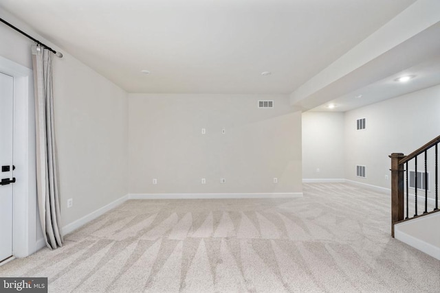 11207 Redlands Trl, Spotsylvania, VA 22551 - spare room with light colored carpet, stairway, baseboards, and recessed lighting