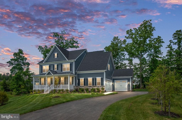 11207 Redlands Trl, Spotsylvania, VA 22551 - view of front of house with covered porch, an attached garage, asphalt driveway, a front lawn, and stone siding