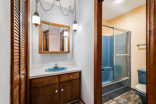 183 Deer Dr, Mcgaheysville, VA 22840 - bathroom featuring vanity, wood finished floors, and shower / bath combination with glass door